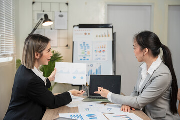 Asian business, women Talk about new projects, presents at home office.