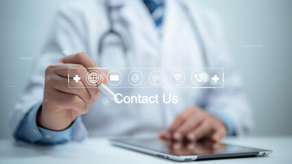 Medical worker using a tablet and touching on virtual screen contact icons email, address, live...