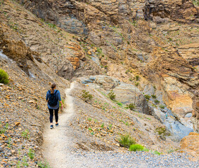 Female Hiker Traveling Through Mosaic Canyon,  Death Valley National Park, California, USA