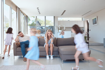 Parents, children and running in home with chaos, stress and overwhelmed environment with headache...
