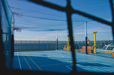 Basketball and sports court on outdoor deck of modern cruise ship liner or cruiseship