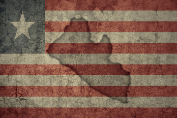 map and flag of liberia on a old vintage crack paper background .