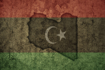 map and flag of libya on a old vintage crack paper background .