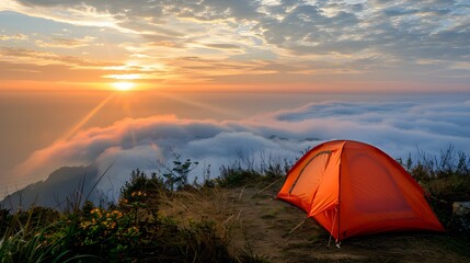 Camping tent on the sunset in the mountains fog beautiful sea view. Beautiful wonders of nature