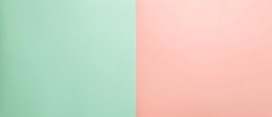Fototapeta premium Split background in mint green and soft peach offers a minimalist and elegant backdrop for creative projects, exuding calm and femininity