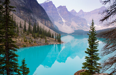 Lake Moraine Turquoise Water Mirror Surface with Canadian Rocky Mountains Behind, Banff, Alberta,...