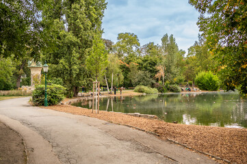 Vienna, Austria, August 21, 2022. Nice view of the Stadtpark. The pedestrian path runs along the lake. People. Concept of rest and relaxation in nature.