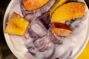 natural yogurt in a white bowl with fruits
