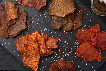 Mix of dried meat Jerky . From chicken , beef and pork.
