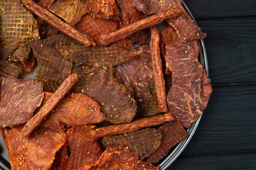 Mix of dried meat Jerky . From chicken , beef and pork.