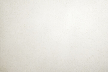 Beige speckled paper texture background