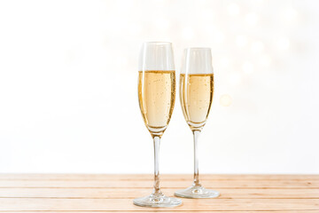 Two Glasses of Champagne on Wooden Table
