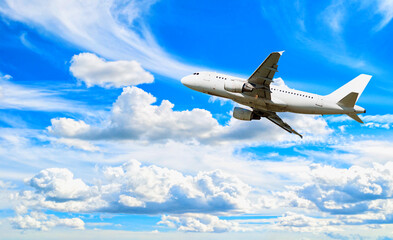 Airplane flying in the blue sky, travel background with commercial airplane in flight