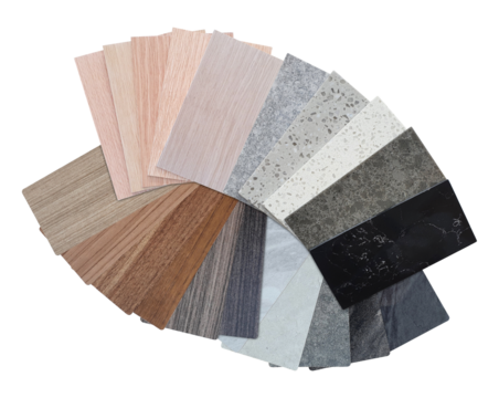 interior material samples swatch including various type and colors of wooden veneer, multi colors of marble laminated and quartz artificial stone isolated on background with clipping path, top view.