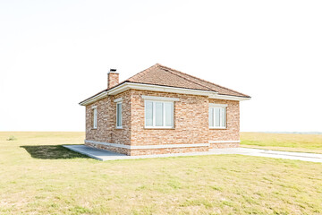 Obraz premium Brick House with White Windows