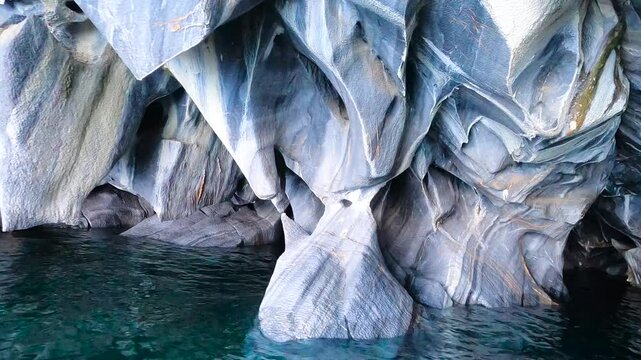 Close-up view of the marble caves entering slowly into the cave Cuevas de M&aacute;rmol.