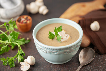Homemade mushroom soup in bowl on the table.