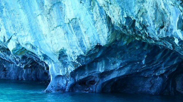  Approaching and entering the marble caves with changing colors of the mineral as you go deeper in the cave Cuevas de M&aacute;rmol.