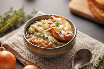 Classic French onion soup baked with cheese croutons sprinkled with fresh thyme.