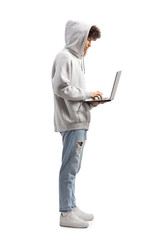 Guy with hoodie standing and working on a laptop computer