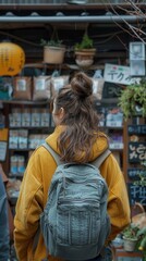 Fototapeta premium A woman with a backpack standing outside a market.