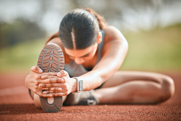 Girl, stretching leg and athlete on ground, outdoor warm up and prepare for start of running. Female person, track and getting ready for marathon training, flexible and muscle for sports performance