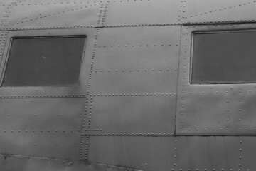 Fragment of an airplane fuselage with windows.