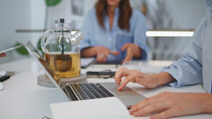 Freelancer hands using laptop closeup. Corporate manager work online in office
