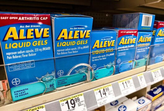 Miami, Florida - June 30, 2024: Aleve liquid gels on pharmacy shelf for pain relief and fever reduction