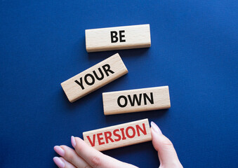 Be your own version symbol. Concept words Be your own version on wooden blocks. Businessman hand. Beautiful deep blue background. Business and Be your own version concept. Copy space