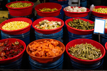 Different fruit and vegetable pickles at a farmers' market in Turkey.