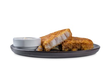 Fried pollock fish with cream sauce and cucumber and radish salad on a white isolated background