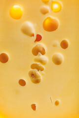 maasdam cheese background, close-up view