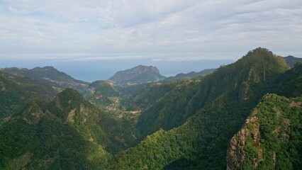 Fototapeta premium Green valleys majestic mountains drone view. Scenic landscape dense forests