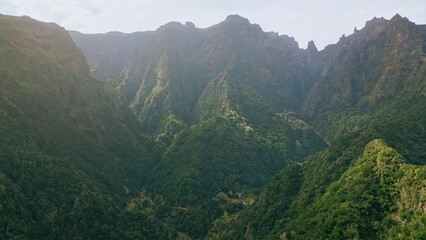Fototapeta premium Drone mountains covered woodland. Majestic panorama green valleys with cliffs