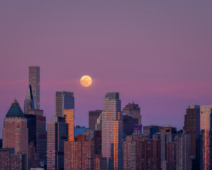Manhattan skyline with a full moon 