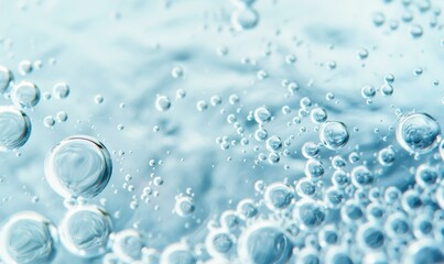 Close-up of bubbles and water ripples on a light blue background.
