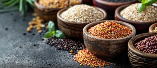 Fototapeta premium Assortment of Grains in Wooden Bowls on a Dark Surface