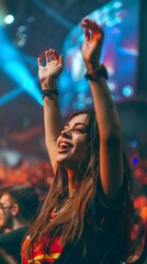 Fototapeta premium A woman is dancing and smiling in a crowd
