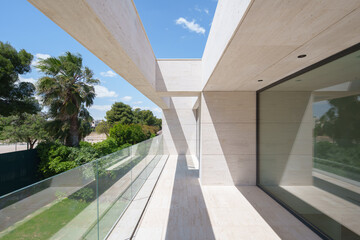 Modern architectural design of a concrete house with glass features