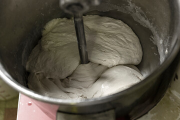 Dough being mixed in large industrial mixer