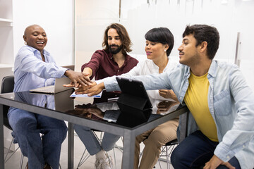 Diverse team of educators celebrating teamwork in English academy