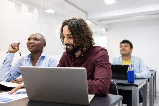 Diverse team collaborating in a modern classroom setting