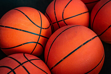 close up of orange basketballs in a bunch