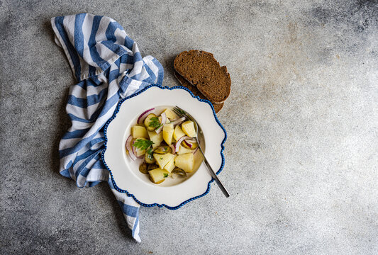 German potato salad with red onion and cucumber