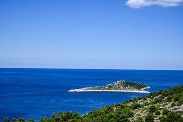 Beautiful landscape of kornati national park in croatia showing turquoise water on a sunny day with white clouds