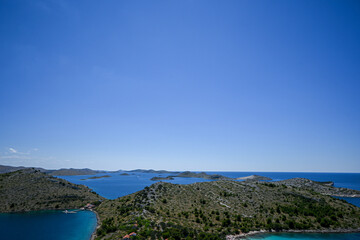 Beautiful landscape of kornati national park in croatia showing turquoise water on a sunny day with white clouds