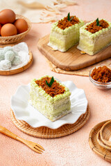 kelepon or klepon cake made from glutinous rice flour and filled with brown sugar covered with grated coconut.