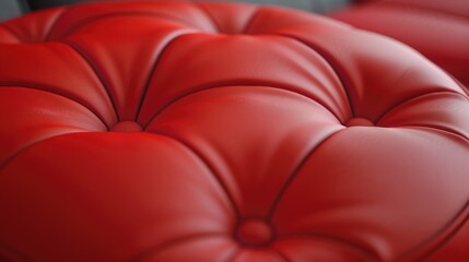 Fototapeta premium A detailed view of a red leather chair's surface, suitable for use in design or editorial contexts