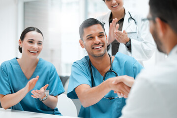 Hospital, clapping or doctors shaking hands for promotion, good job or interview success in...